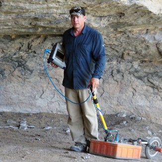 Dr. Chet Walker using GPR (ground-penetrating radar) at Kelley Cave